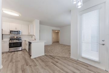 Chula Vista apartment for rent - A kitchen with white cabinets and a microwave above the stove.