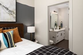 Atlanta apartment for rent - a bedroom with a bed and a bathroom with a sink and a mirror
