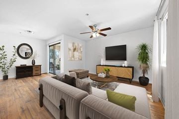 Casa Grande apartment for rent - A living room with a grey couch and a wooden floor.