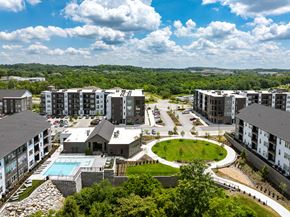 Antioch apartment for rent - an aerial view of an apartment complex with a pool and green field