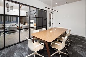 Antioch apartment for rent - a conference room with a wooden table and white chairs