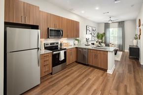 Dalton apartment for rent - a kitchen with stainless steel appliances and wooden cabinets