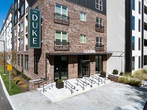 Nashville apartment for rent - The Duke building is a brick apartment complex with a leasing office.