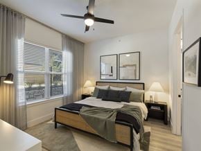 Leander apartment for rent - a bedroom with a bed and a ceiling fan