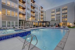 Salt Lake City apartment for rent - A large swimming pool in front of apartment buildings.