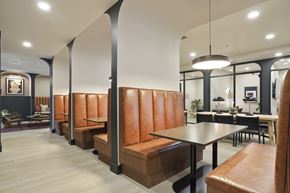 Salt Lake City apartment for rent - A modern dining area with a long table and chairs.