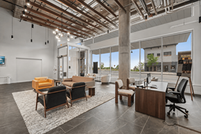 Duluth apartment for rent - A modern office space with a wooden ceiling and furniture.