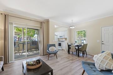 San Diego apartment for rent - A living room with a blue couch and a coffee table.