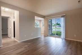 Indianapolis apartment for rent - a living room with wood floors and a sliding glass door