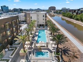 Scottsdale apartment for rent - Exterior apartment complex with a pool and palm trees.