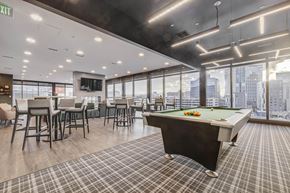 Salt Lake City apartment for rent - a games room with a pool table and a view of the city