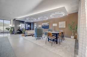 West Valley apartment for rent - A modern dining area with a table set for six and a large window.