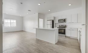 West Valley apartment for rent - an empty kitchen with white cabinets and a white counter top