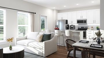Richmond Hill apartment for rent - A modern kitchen with white cabinets and appliances, a dining table with chairs, and a living area with a sofa and a coffee table.