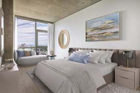 Seattle apartment for rent - A bedroom with a large bed and a painting on the wall.