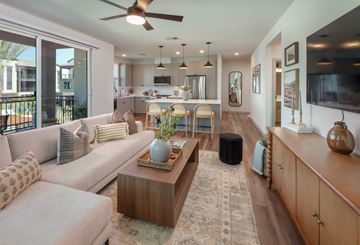 Mesa apartment for rent - A living room with a white couch and a wooden coffee table.