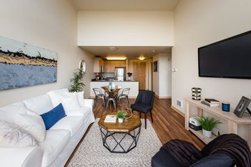 Seattle apartment for rent - a living room with a couch and a table