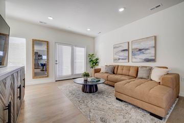 Draper apartment for rent - A living room with a brown couch and a coffee table.
