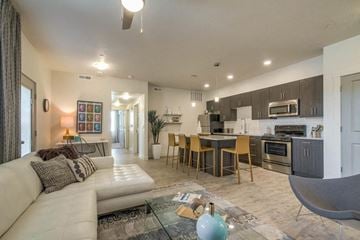 West Haven apartment for rent - a living room and kitchen with a couch and a table