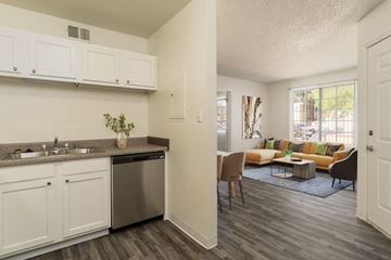 Albuquerque apartment for rent - an open kitchen and living room with a couch and a table