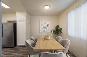 Albuquerque apartment for rent - A dining room with a wooden table and chairs.