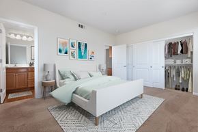 Pleasanton apartment for rent - a bedroom with white walls and carpet