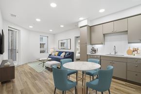 Duarte apartment for rent - A modern kitchen with a dining table and chairs.