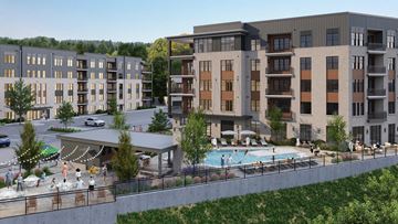 Asheville apartment for rent - A large apartment complex with a pool and a covered outdoor area.