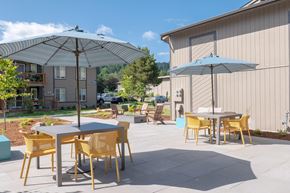 Corvallis apartment for rent - a patio with tables and umbrellas  at Veri at Timberhill, Corvallis, OR
