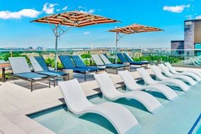 Washington apartment for rent - A pool area with sun loungers and plus seating near DCA. Rooftop Pool | 113 Potomac Ave SW Washington, DC 20024