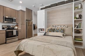 Tempe apartment for rent - a bedroom with a bed and a kitchen