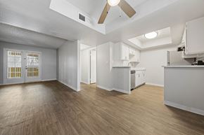 Tempe apartment for rent - Luxury Apartments for Rent in Tempe - Villatree - Living Room with Wood-Style Flooring, Ceiling Fan, and Open Layout
