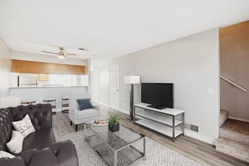 Santa Rosa apartment for rent - A living room with a grey couch and a black television.