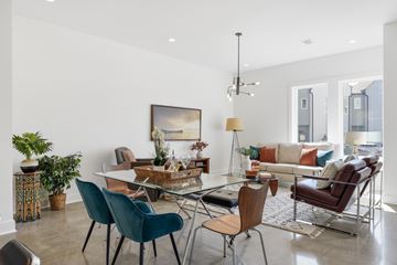 Madison apartment for rent - A modern living room with a glass table and chairs.