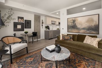Seattle apartment for rent - a living room with a couch and a table