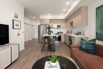 Seattle apartment for rent - a living room with a couch and a table