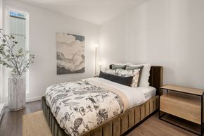 Seattle apartment for rent - a bedroom with a large bed and a window
