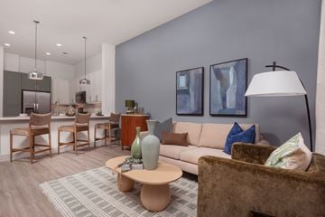 Frisco apartment for rent - A living room with a brown couch and a coffee table.