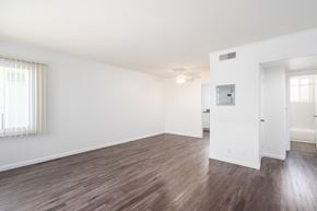 Daly City apartment for rent - A room with wooden flooring and white walls.