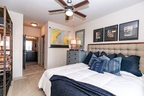 Atlanta apartment for rent - A bedroom with a large bed and a ceiling fan. at Westmount at Ashwood Apartments, Georgia, 30338