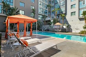 Los Angeles apartment for rent - A pool area with sun loungers and a canopy at Wilshire Vermont, Koreatown, Los Angeles