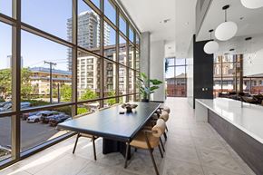 Seattle apartment for rent - A modern dining room with a long table and chairs.