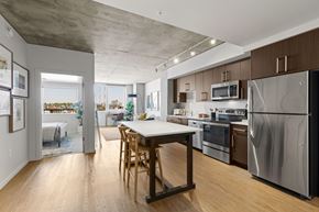 Seattle apartment for rent - A kitchen with a table and chairs in the middle of it.