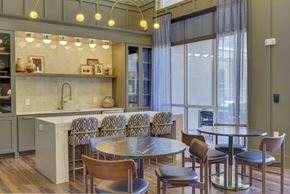 Dallas apartment for rent - A modern kitchen with a dining table and chairs.