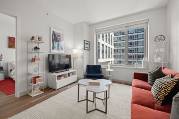 San Francisco apartment for rent - A living room with a red couch and a white coffee table.