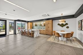 University Place apartment for rent - A dining room with a table surrounded by chairs.