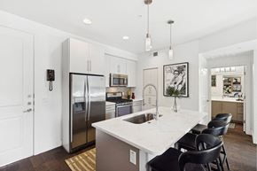 Scottsdale apartment for rent - A kitchen with a white counter top and a refrigerator.