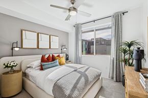 Scottsdale apartment for rent - A bedroom with a large bed and a ceiling fan.