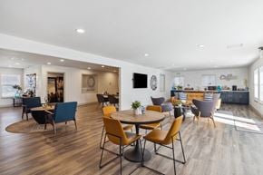 Santa Rosa apartment for rent - A modern dining room with a round table and chairs.