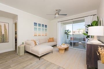 Peoria apartment for rent - a living room with a white couch and a sliding glass door
